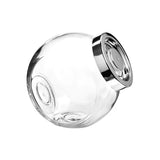 Clear glass jar with a silver lid on a white background