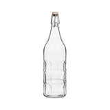 Clear glass panelled bottle with a cork stopper on a white background