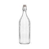 Clear glass panelled bottle with a metal clasp on a white background