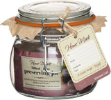Glass preserving jar with a decorative tag and label on a white background