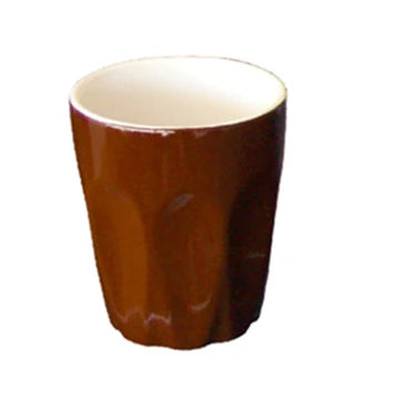 Brown ceramic cup on a white background