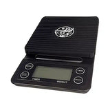 Black digital coffee scale with a logo on a white background