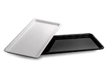 Two deli displays trays, one silver and one black, on a white background
