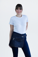 UTILITY POUCH waist apron is compact, comfortable, and practical, featuring multiple pockets. The apron is crafted from durable blue denim material and includes an adjustable waistband with a buckle.