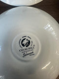 White dish with Churchill branding on a wooden surface