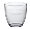Clear glass tumbler with horizontal stripes on a white background