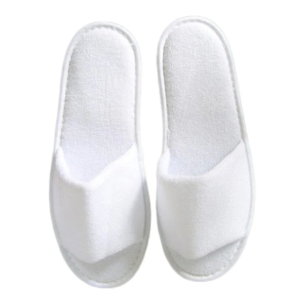Pair of white slippers on a white background