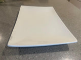 White japanese style fine porcelain plate  on a speckled countertop