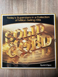 Book cover of 'Gold' by Reader's Digest with gold letters on a reflective surface.