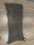 Chainmaille bracelet on a wooden surface